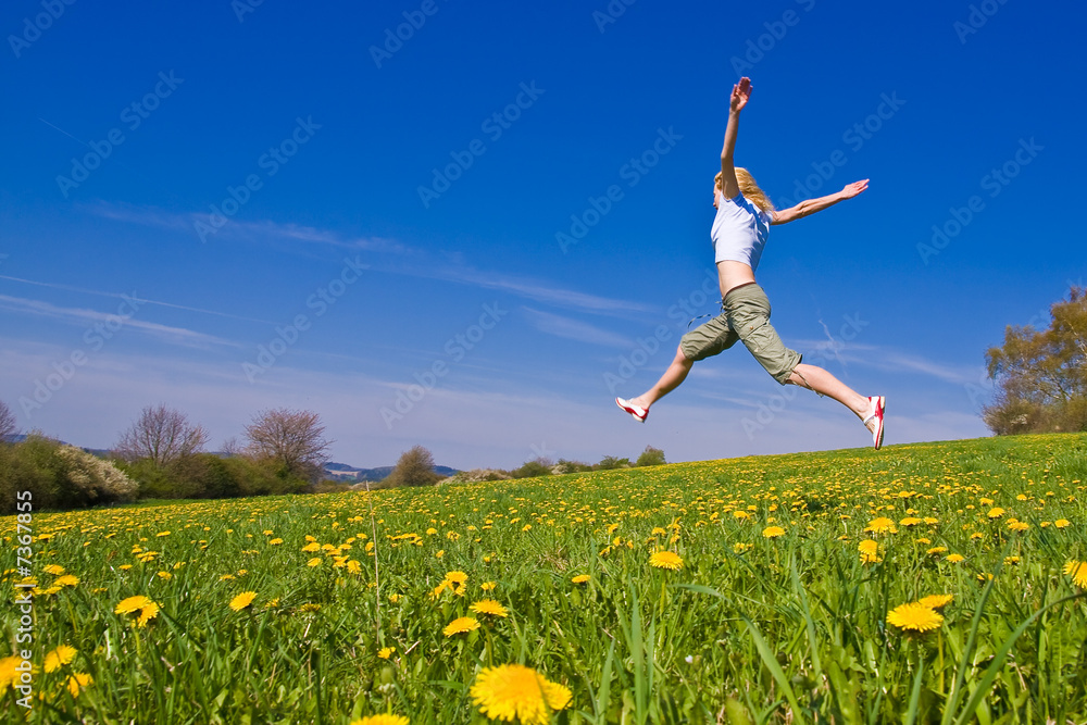 young female having fun on flowery meadow young female having fun on flowery meadow