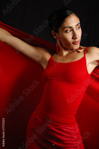 Portrait of hispanic female wearing red clothes