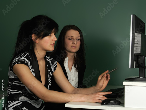 Two girls at the computer