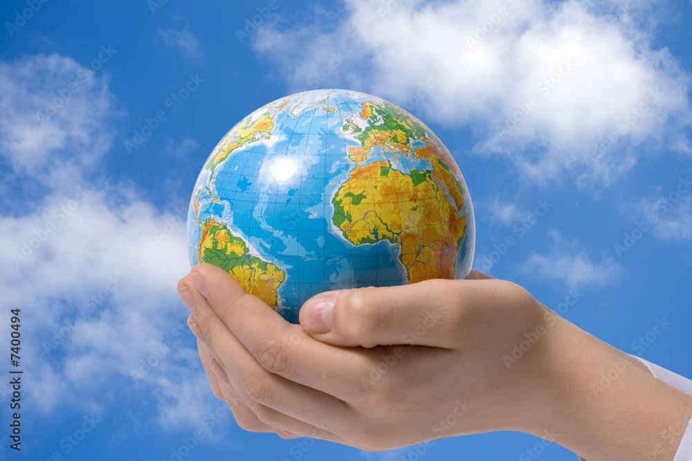 The globe in children's hands The globe in children's hands