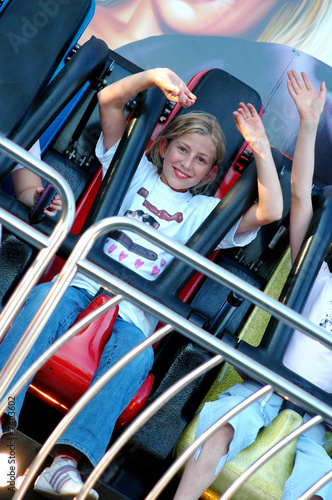 pretty girl on ride at fun fair photo