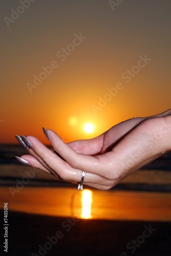 sun sunset on  hand