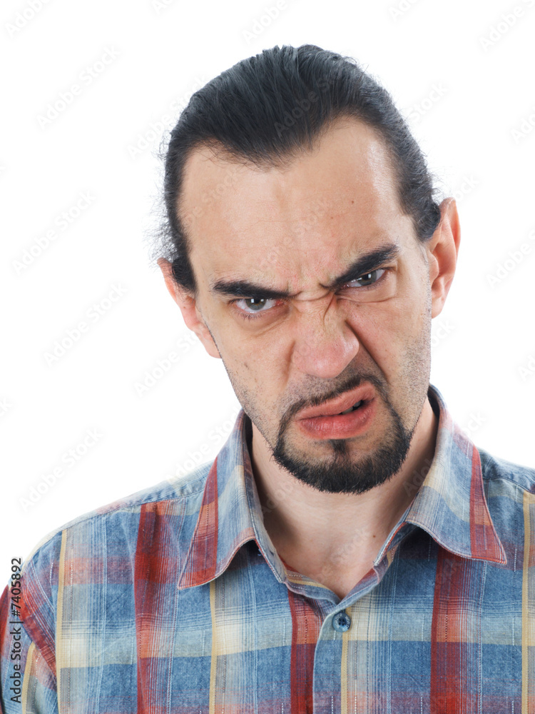 A middle age man gives a skeptical look A middle age man gives a skeptical look