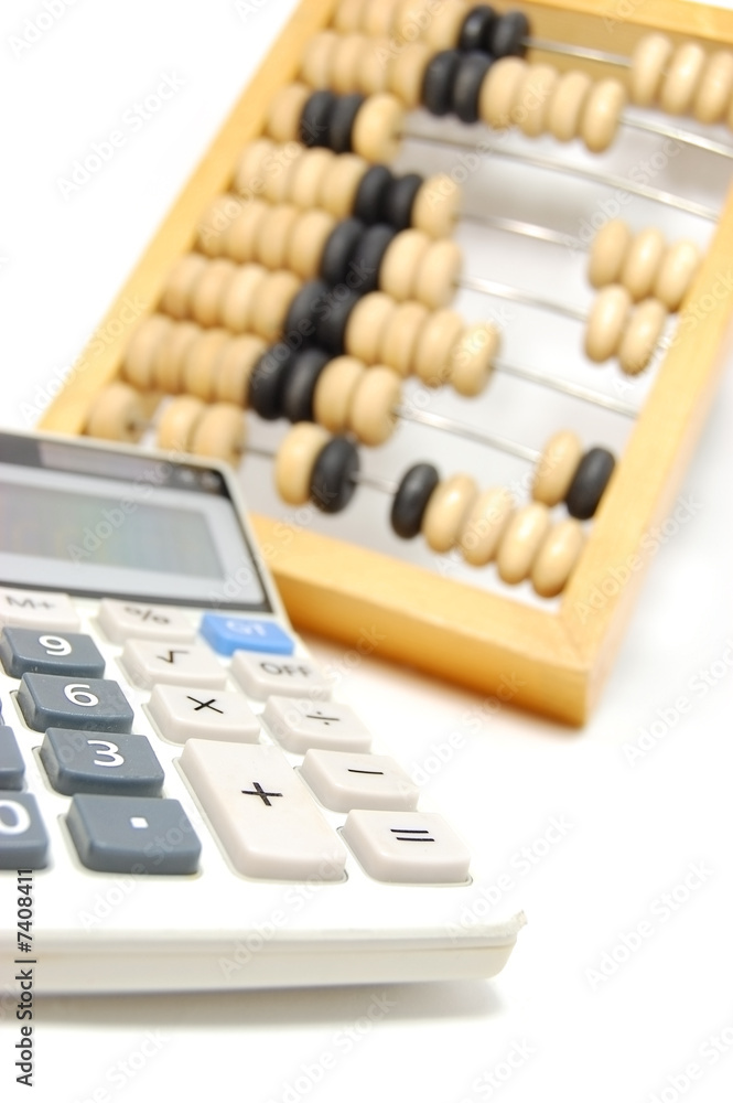 Abacus and calculator isolated on white Abacus and calculator isolated on white