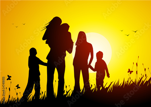 Happy family at sunset