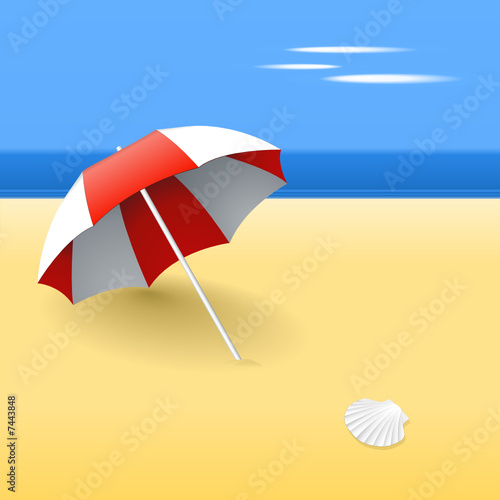 Beach umbrella on a beach, with a scallop shell