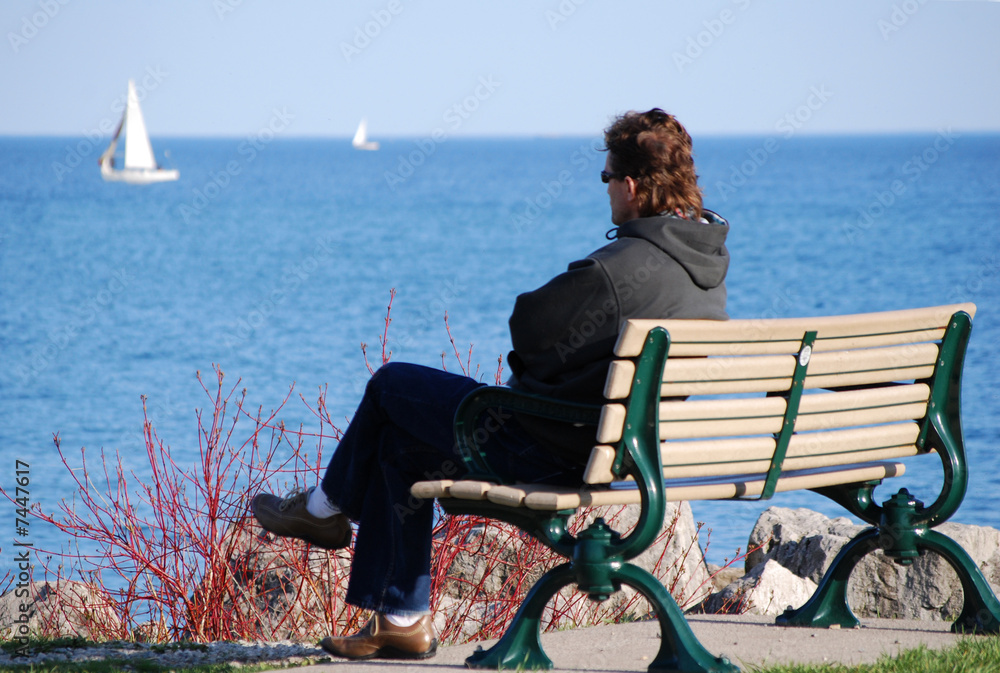 Man watching sail boats