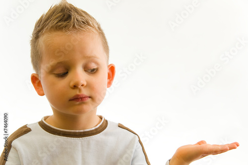Child showing something on hand