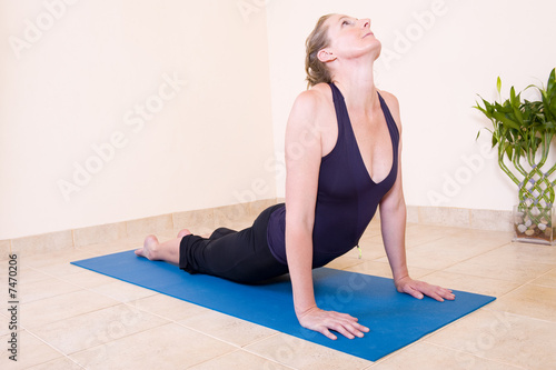 Beautiful lady doing yoga photo