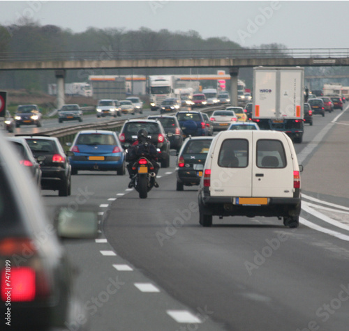 motor between cars in trafficjam