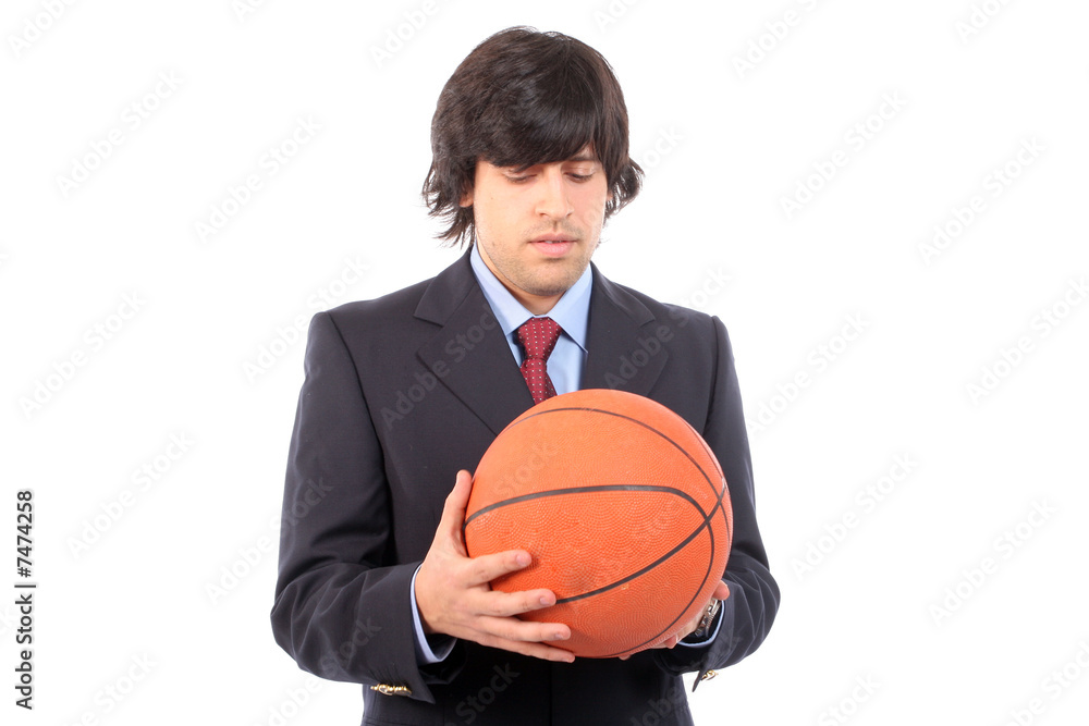 Business man holding basketball ball