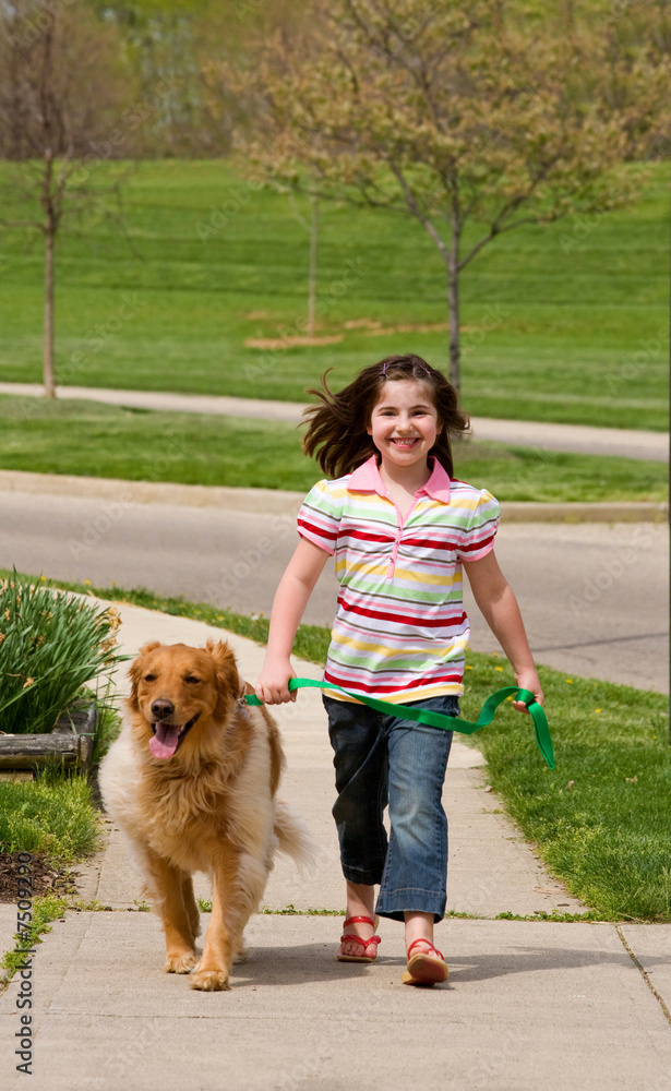 Girl Walking Down the Sidewalk With Dog Girl Walking Down the Sidewalk With Dog