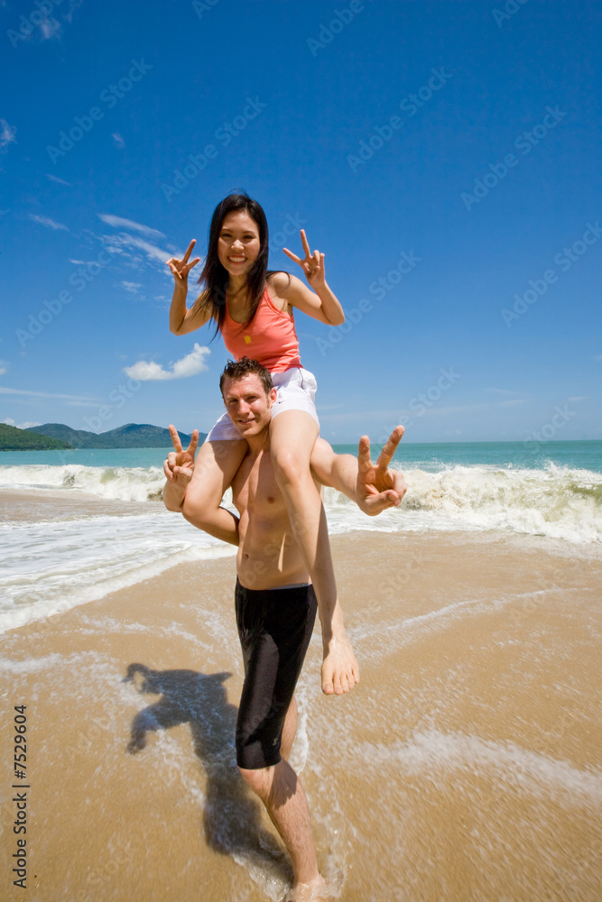 Fototapeta premium couple playful by the beach