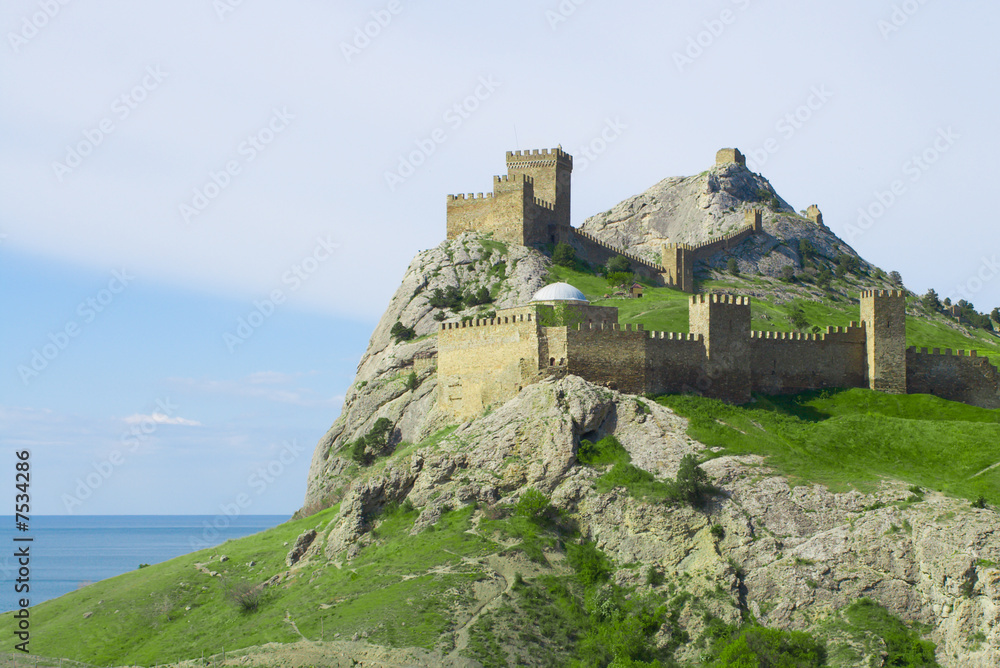 Genoese fortress on green mountain over sea in Crimea