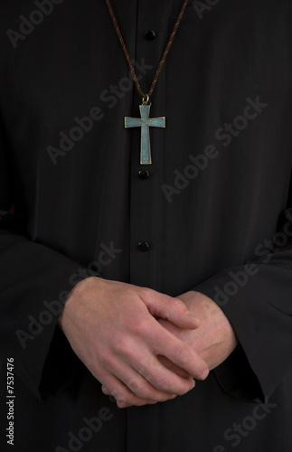 Priest, crucifix and hands
