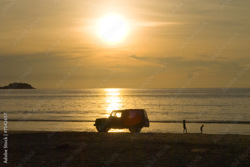 car at the sunset, Patong beach, Phuket, Thailand car at the sunset, Patong beach, Phuket, Thailand