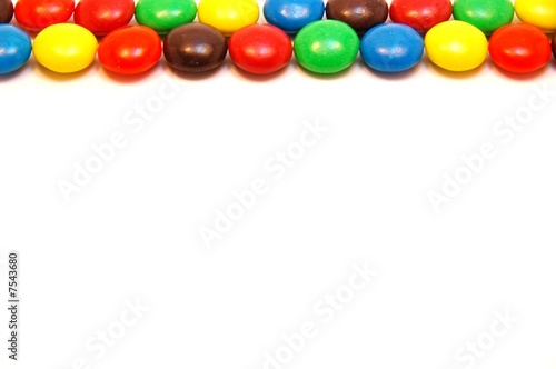 Chocolate candy border on white background