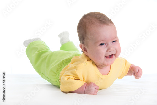 Smiling baby on bed