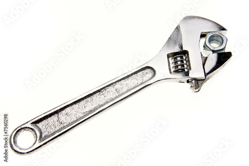 Wrench and nut isolated on white background © Stillfx