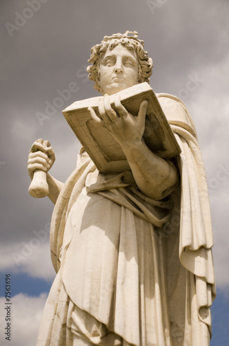 Classical greek statue of woman with the book