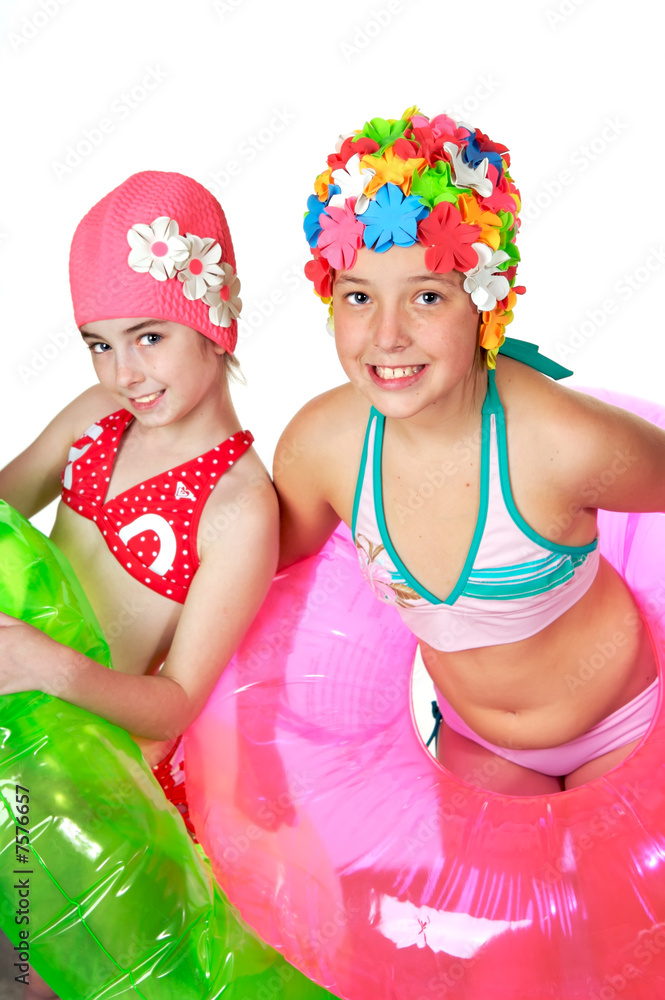 Beautiful little girls in a flowered swim caps Beautiful little girls in a flowered swim caps