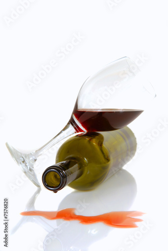 Wine bottle and glass resting on their sides