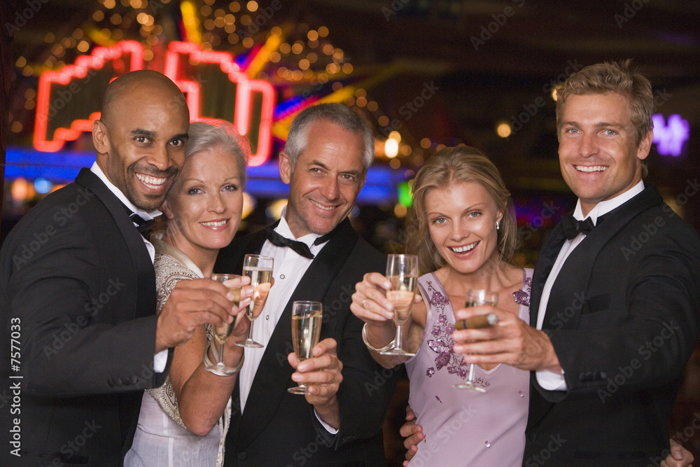 Group of friends celebrating win at casino Group of friends celebrating win at casino