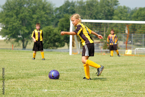 Young Girl Soccer Player Prepares to Kick
