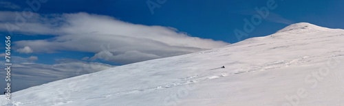 Snowy white mountain slope with blue sky panorama © Svetoslav Iliev