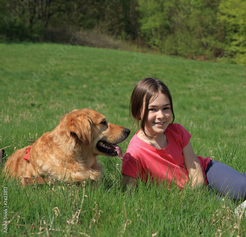 Girl with dog on meadow