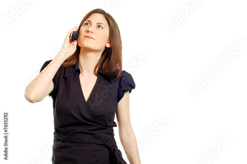 chic young woman in black dress on the phone