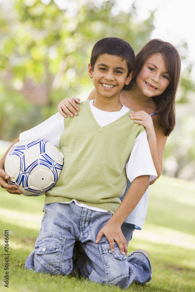 Obraz premium Children playing football in park
