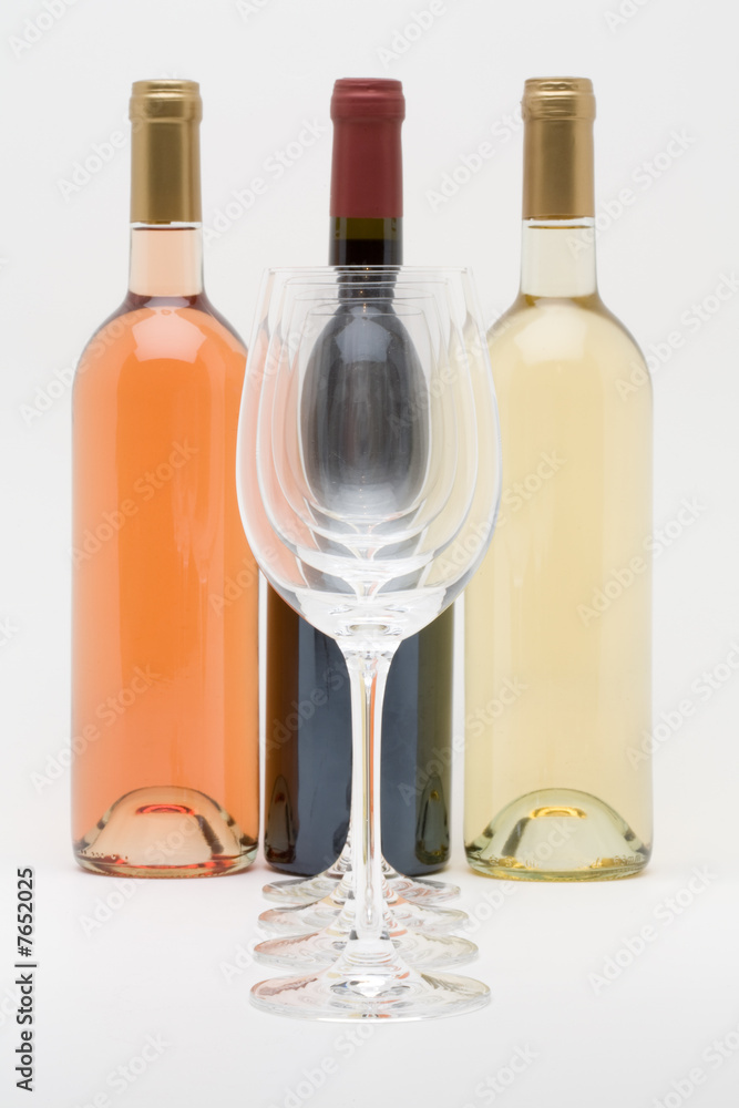 red white and rose wine bottles with glasses in front red white and rose wine bottles with glasses in front