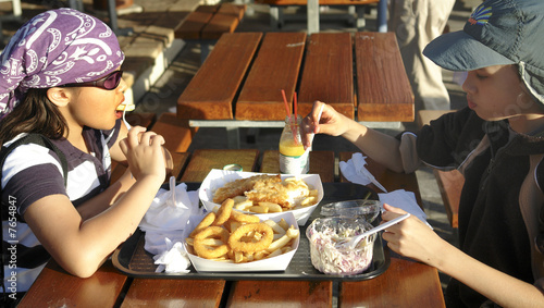 children eating fish and chips