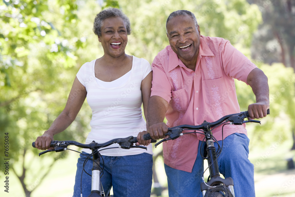 Senior couple on cycle ride - obrazy, fototapety, plakaty 