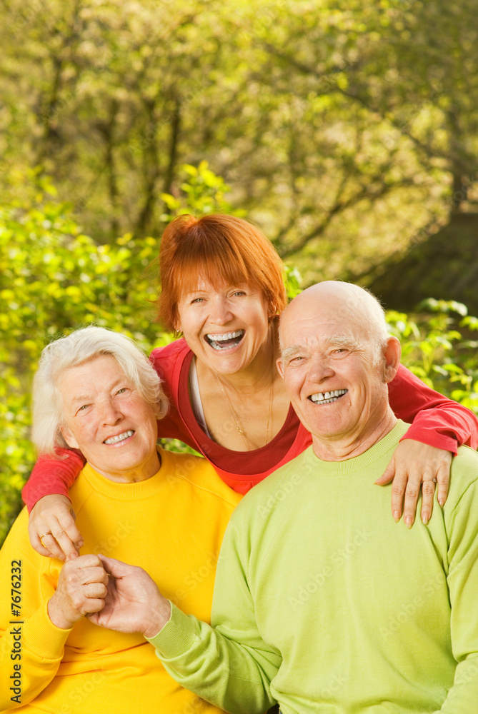 Senior couple with their daugther outdoors Senior couple with their daugther outdoors