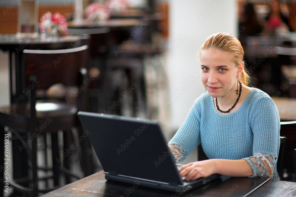 girl with computer in cafe girl with computer in cafe