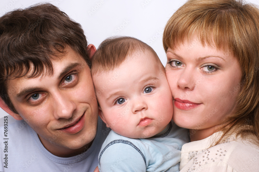 Beautiful young happy family, isolated on white. Beautiful young happy family, isolated on white.