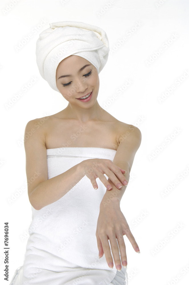 Beautiful woman wearing white towel on her head Beautiful woman wearing white towel on her head
