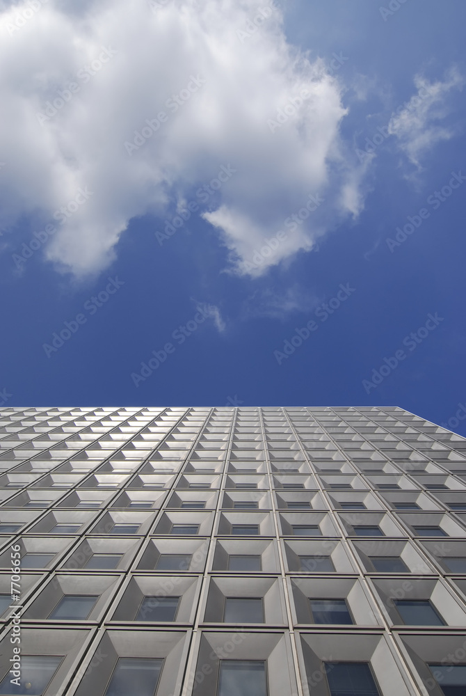 Structured facade of modern office building with windows Structured facade of modern office building with windows