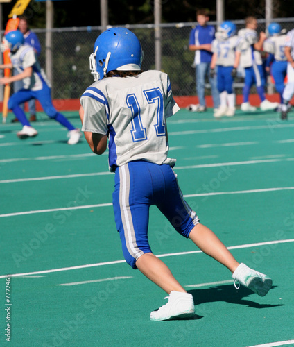 Youth Football Player Just Catching Ball