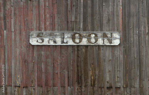 Old Saloon Sign on Weathered Wood Wall