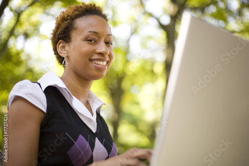 Woman Smiling and Typing