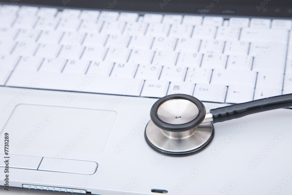 stethoscope on laptop stethoscope on laptop