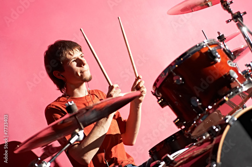 man playing on drum