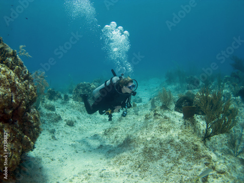 Scuba Diver swimming over a Cayman Island Reef