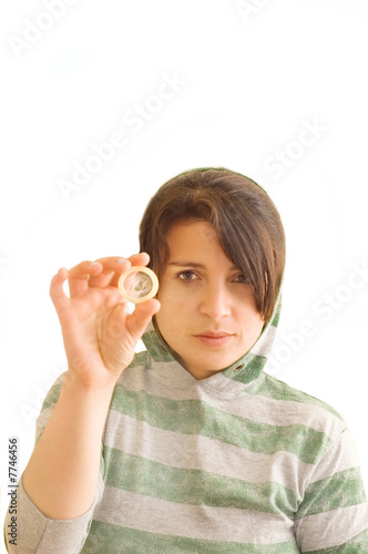 Adolescent female holding a condom.