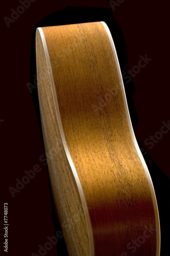 Acoustic Guitar Body Profile on a Black Background
