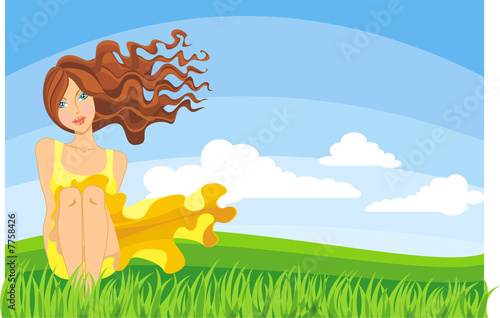 Young woman sitting on the grass