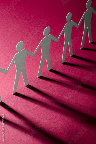 figures of man in paper on magenta